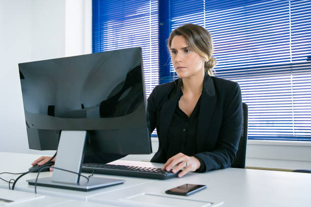 istock Focused young business lady working in her office 1280305048