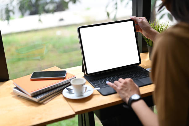 istock Cropped shot of an office worker using a computer tablet with white screen in office. 1280306285