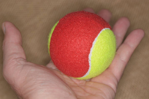 istock Hand with tennis ball 1280307938