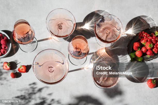 Rose Wine Glasses With Summer Berries And Shadows Stock Photo - Download Image Now - Wine, Rose Wine, Summer