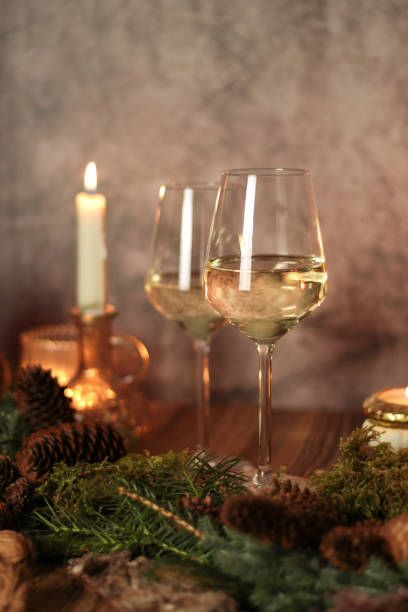 istock White Wine in autumn food scene on rustic table with candles 1280309224
