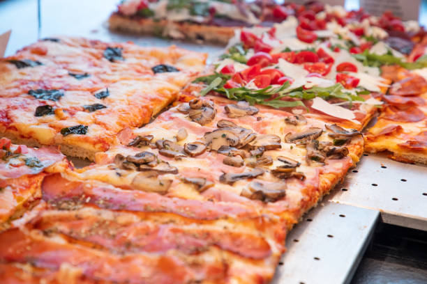 istock Various types of pizza al taglio displayed in takout showcase 1280309663