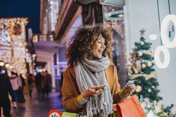 istock Young woman shopping for Christmas 1280310493