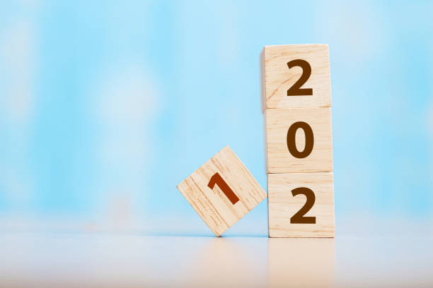 istock 2021 wooden cube block on table background. Resolution, strategy, solution, goal, business and New Year holiday concepts 1280312762