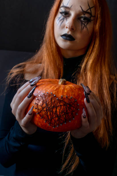 istock Halloween Nail Art Design, hands and decorations. 1280313417