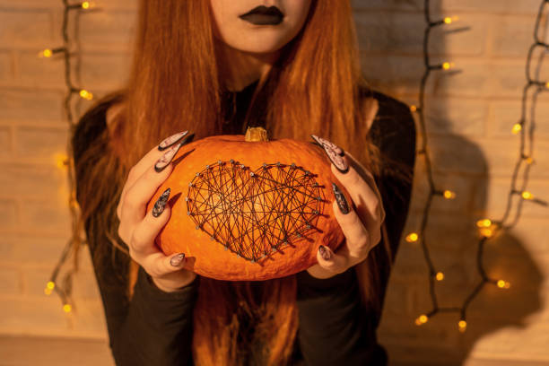 istock Halloween Nail Art Design, hands and decorations. 1280313425