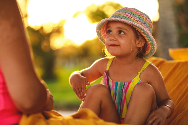 istock Little girl applying sunscreen on legs 1280313806