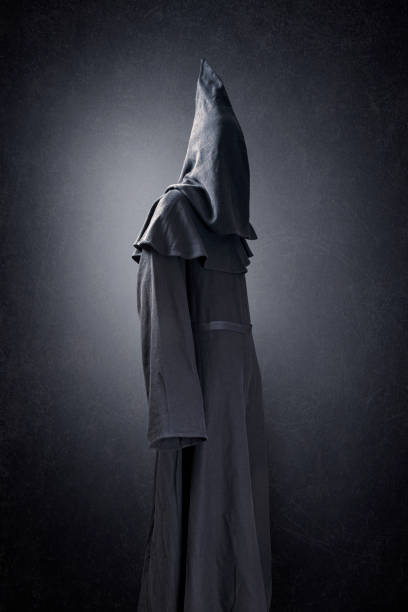 istock Scary figure in hooded cloak 1280315262