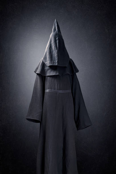 istock Scary figure in hooded cloak 1280315265