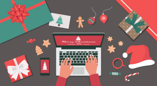 istock Merry Christmas and Happy New Year lettering on the laptop top view table 1280316667