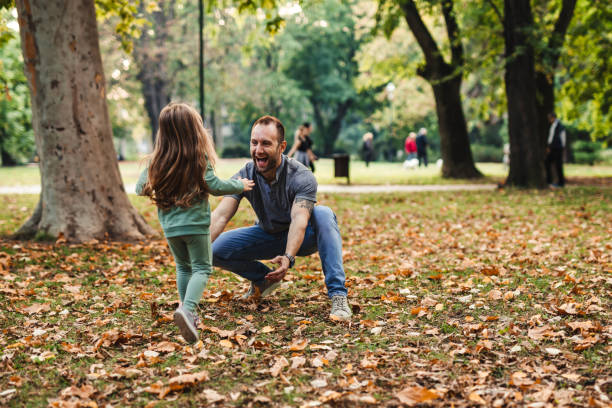 istock Father waiting his daughter to hug her 1280317370