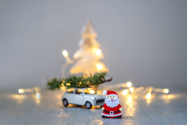 istock Santa Claus and car transporting Christmas tree. 1280317396