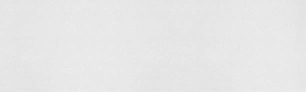 istock Light gray kraft paper texture. Grey fine textured cardboard wide background 1280317521