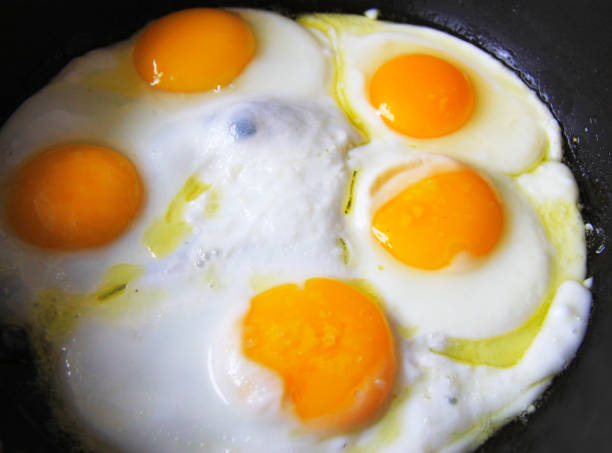 istock Morning roasted whole eggs on the black pan 1280317618