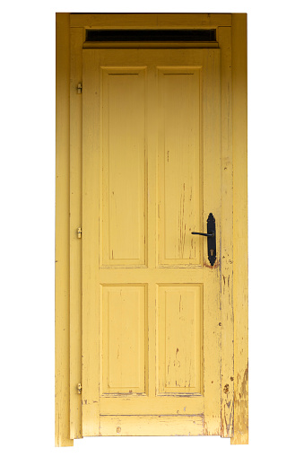 Vintage yellow door isolated on white background. For copy space