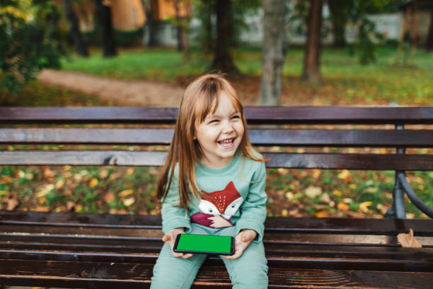 istock Happy little beauty holding smartphone. Copy Space. 1280317933