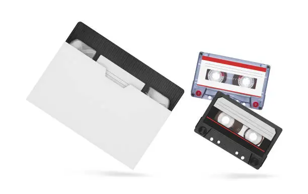 VHS video tape and audiocassette isolated on white background