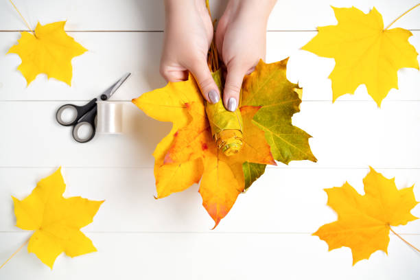 istock Making a flower from autumn maple leaves. Step 14 of 15 1280318118