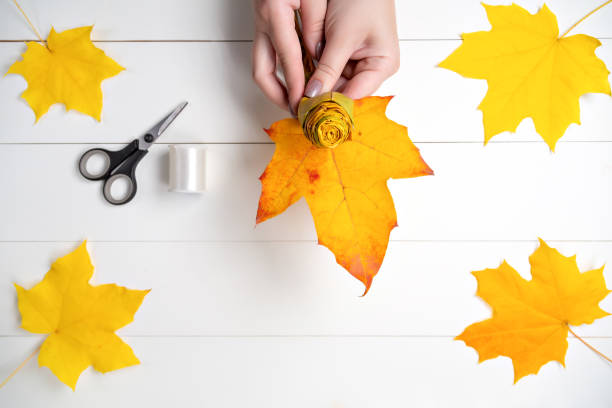 istock Making a flower from autumn maple leaves. Step 13 of 15 1280318851