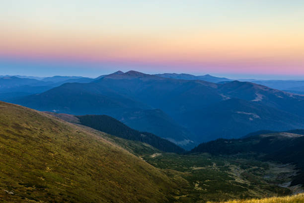 Carpathian mountains. Hoverla and Peter at sunset