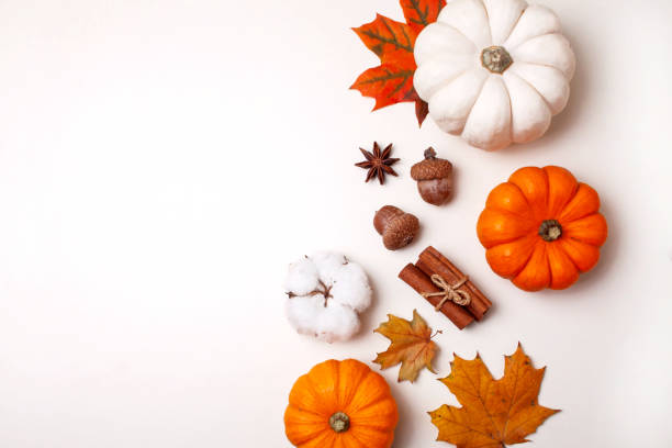 istock Small decorative pumpkins and autumn leaves on white table. Flat lay style 1280319766