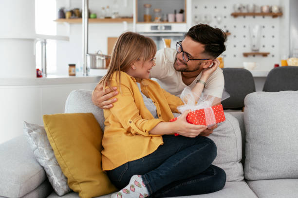 istock Boyfriend surprising his girlfriend with a gift. 1280322537