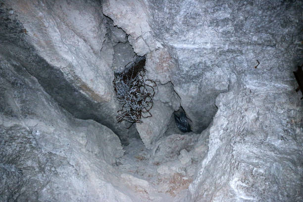 istock old abandoned galleries, adits, for extraction and processing of natural stone and gypsum cave. Dark eerie stone, quartz tunnels deep in  earth. Various rocks, geological and speleological research. 1280323488