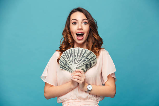 istock Excited young lady showing money. 1280323942