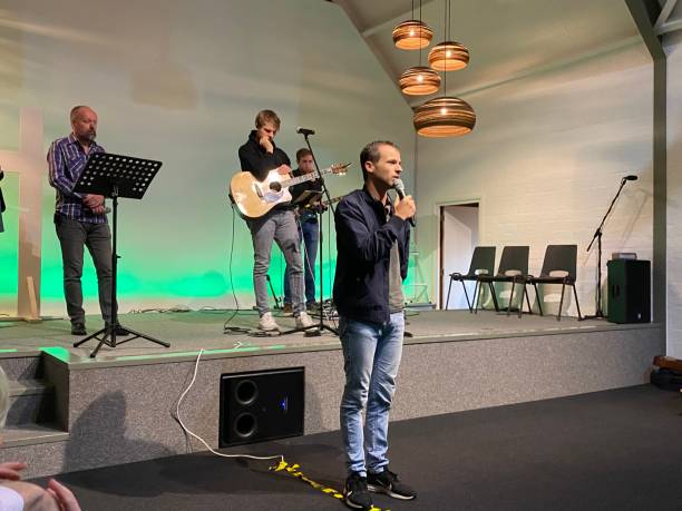 Church event with orona Distancing Schinnen, the Netherlands, - August 30, 2020. People coming together for a religious meeting in the local Pentecostal Church, as you can see save social distancing is a must. pentecost religious celebration photos stock pictures, royalty-free photos & images