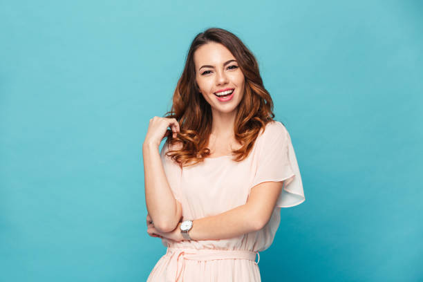 istock Happy young lady over blue background. 1280325260