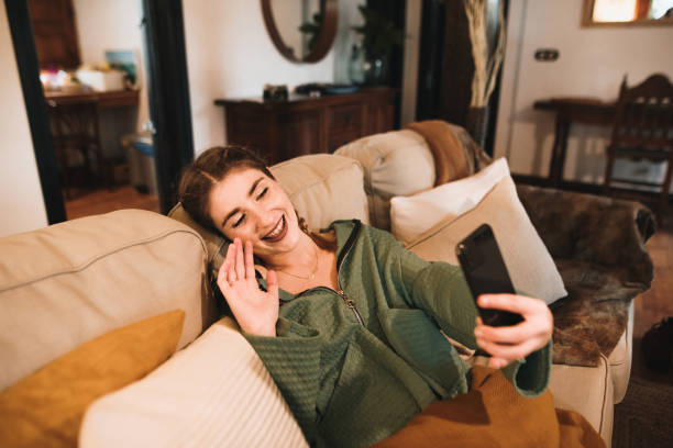 istock Young woman video calling with smart phone 1280325683