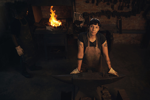 Portrait of a confident young woman working at a foundry