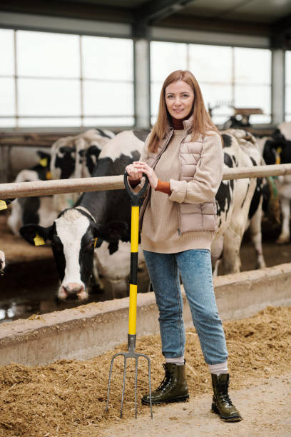 istock Smiling farmhouse owner working with pitchfork 1280326592