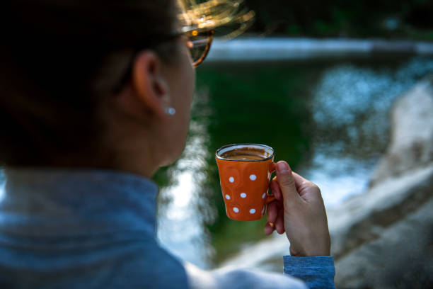 istock Happy woman enjoying in cup of fresh coffee 1280328043