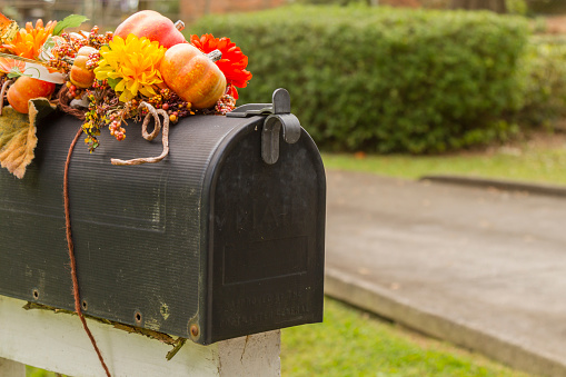 Mailbox decorated for Halloween. Halloween / Fall Decoration Adorns Beautiful Entry Way To Home. Front Porch decorated for the Halloween, Thanksgiving, Autumn season background. Thanksgiving Day.