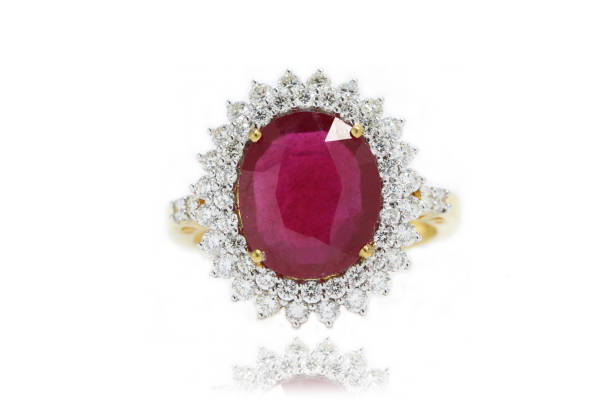 Red Ruby Ring with 2 Line Round Diamond Surrounded in Yellow Gold stock photo