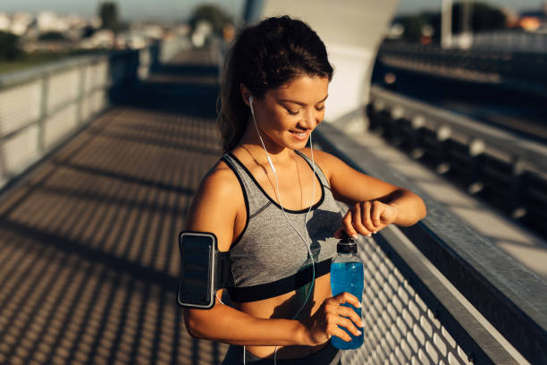 istock Sportswoman resting and hydrating on the bridge 1280333544