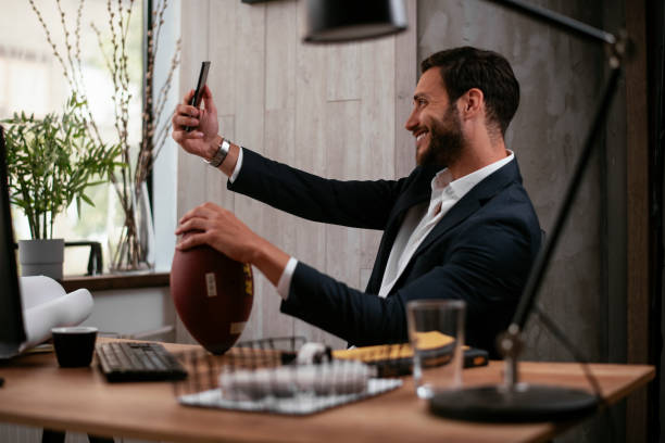 istock Handsome businessman taking selfie in office 1280333564