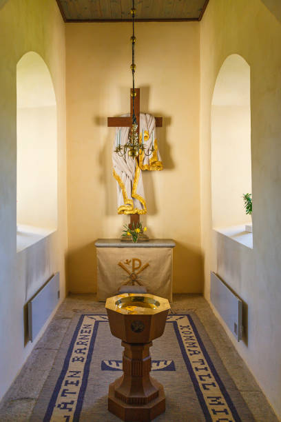 istock Church interior with a baptismal font and altar 1280334882