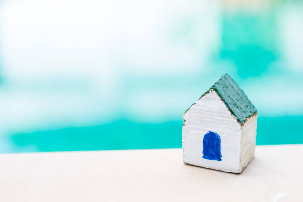 istock Small wooden house over blurred background 1280336184