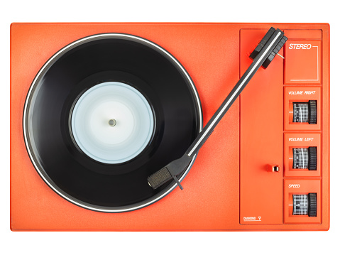Vintage cute orange record player isolated on a white background