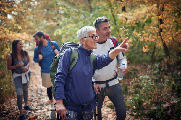 istock An elderly couple at hiking with friends 1280337936