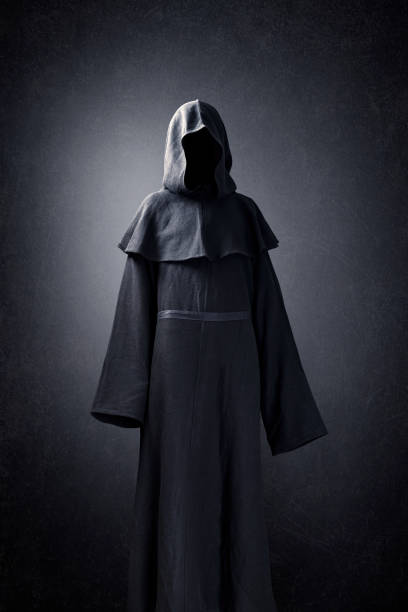 istock Scary figure in hooded cloak 1280338980
