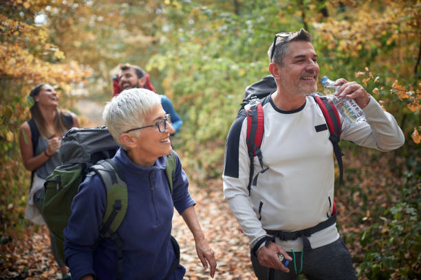 istock Couples having good time at hiking 1280339358