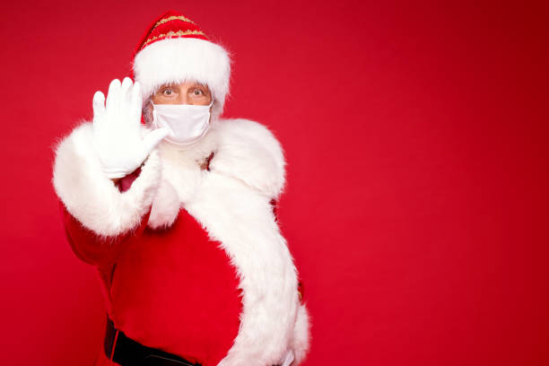 istock Real Santa Claus in white mask posing 1280339658