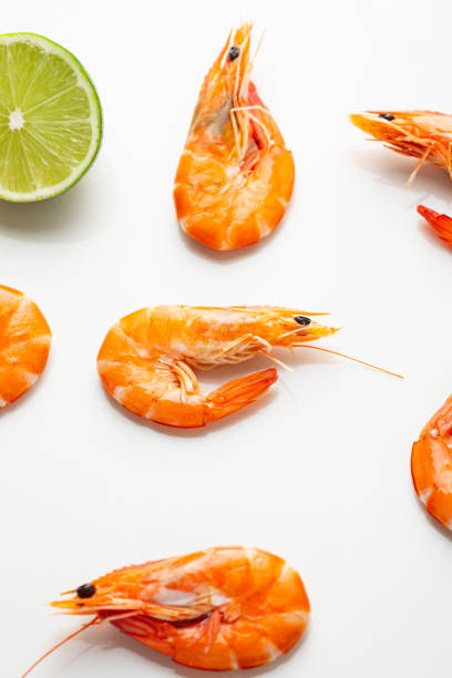 istock Close up of  Shrimps with lime on light surface 1280341094