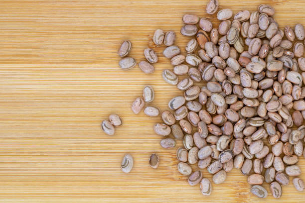 brown beans seeds on a wooden table