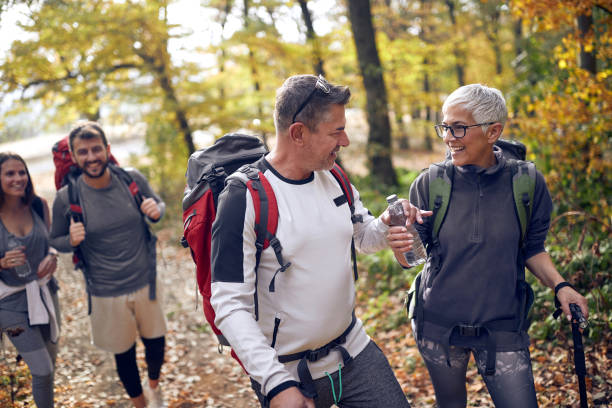 istock An elderly couple at hiking getting thirsty 1280342110