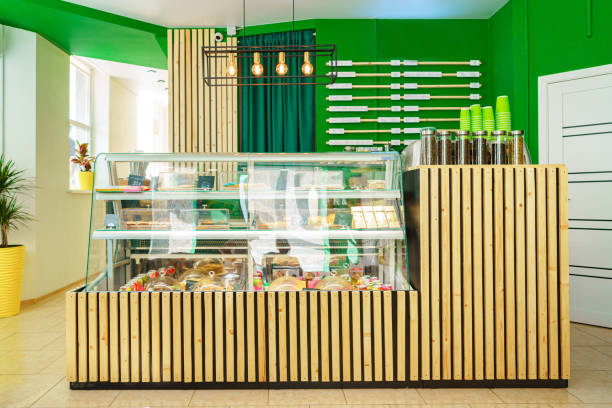 Front view of a wooden coffee shop counter with products