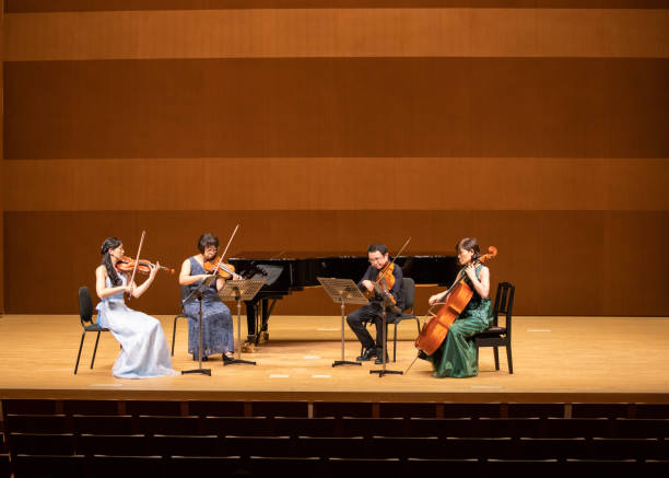 istock Group of musicians playing instruments at classical concert 1280342582